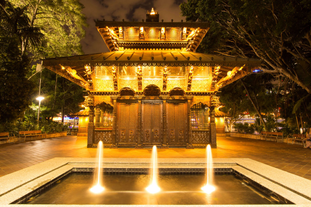 The Nepalese Peace Pagoda, South Bank Brisbane, is lit up in the evening and highlight the detail of the hand crafted structure.