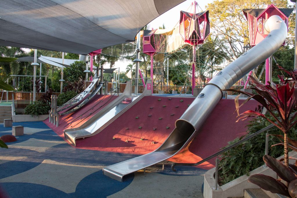 There are slides and a climbing wall at the Riverside Green Playground, South Bank, Brisbane.
