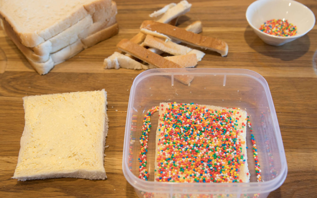 Making Fairy Bread for Fairy Bread Day can be a messy process.